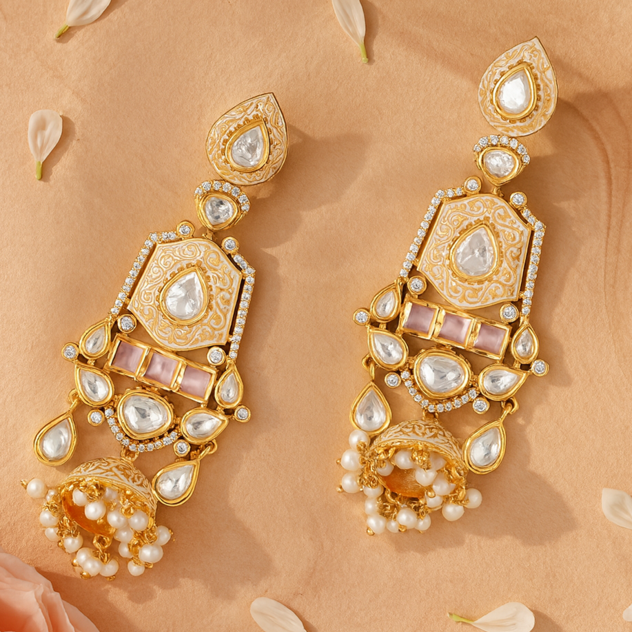 Ornate gold earrings with pearls on a beige background