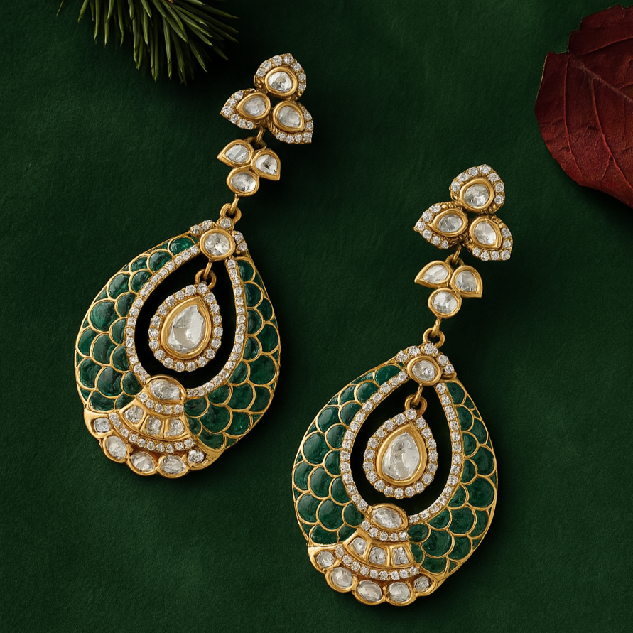 Ornate gold, green, and black earrings on a dark green background with leaves.