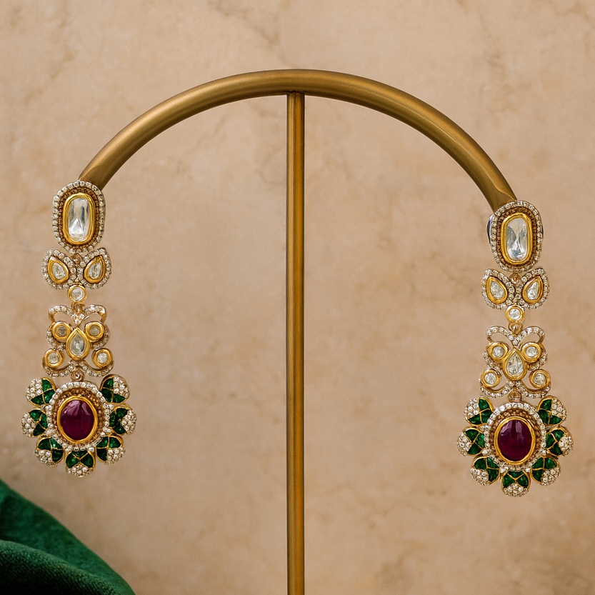 Ornate earrings on a gold stand with a beige background