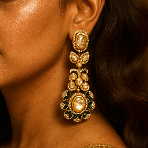 Close-up of a woman wearing ornate gold earrings with a warm background