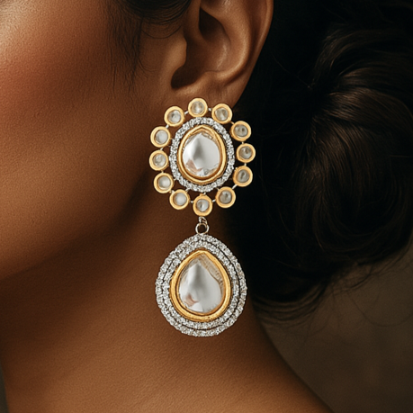 Woman wearing elegant earrings against a dark background