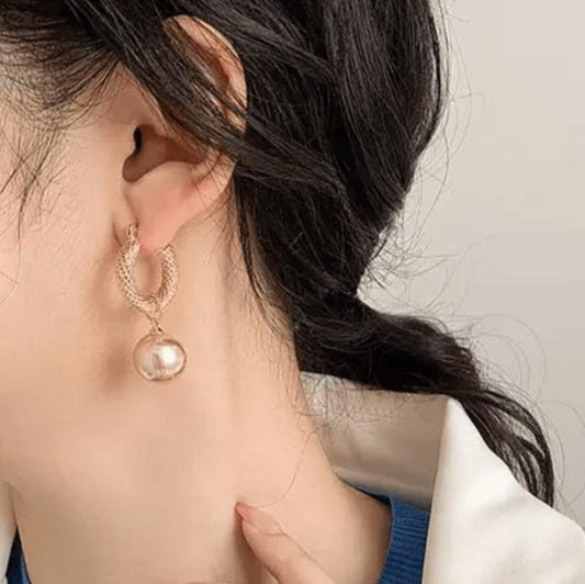 Gold plated round shaped pearl earring