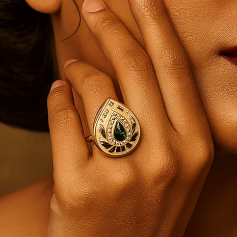 Woman with a gold ring on her finger against a warm brown background