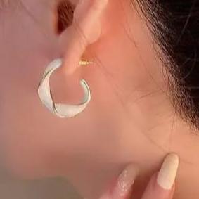 Twisted white crystal hoop earrings