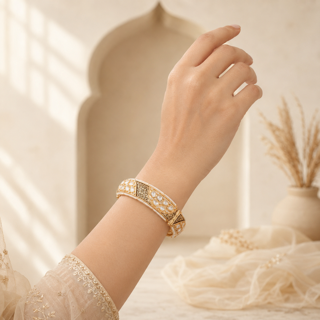Woman wearing Aaradhya antique gold Kundan-style kada bangle