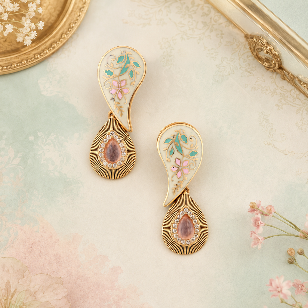 Aarini ivory Meenakari paisley earrings displayed on a soft aqua, blush and ivory background