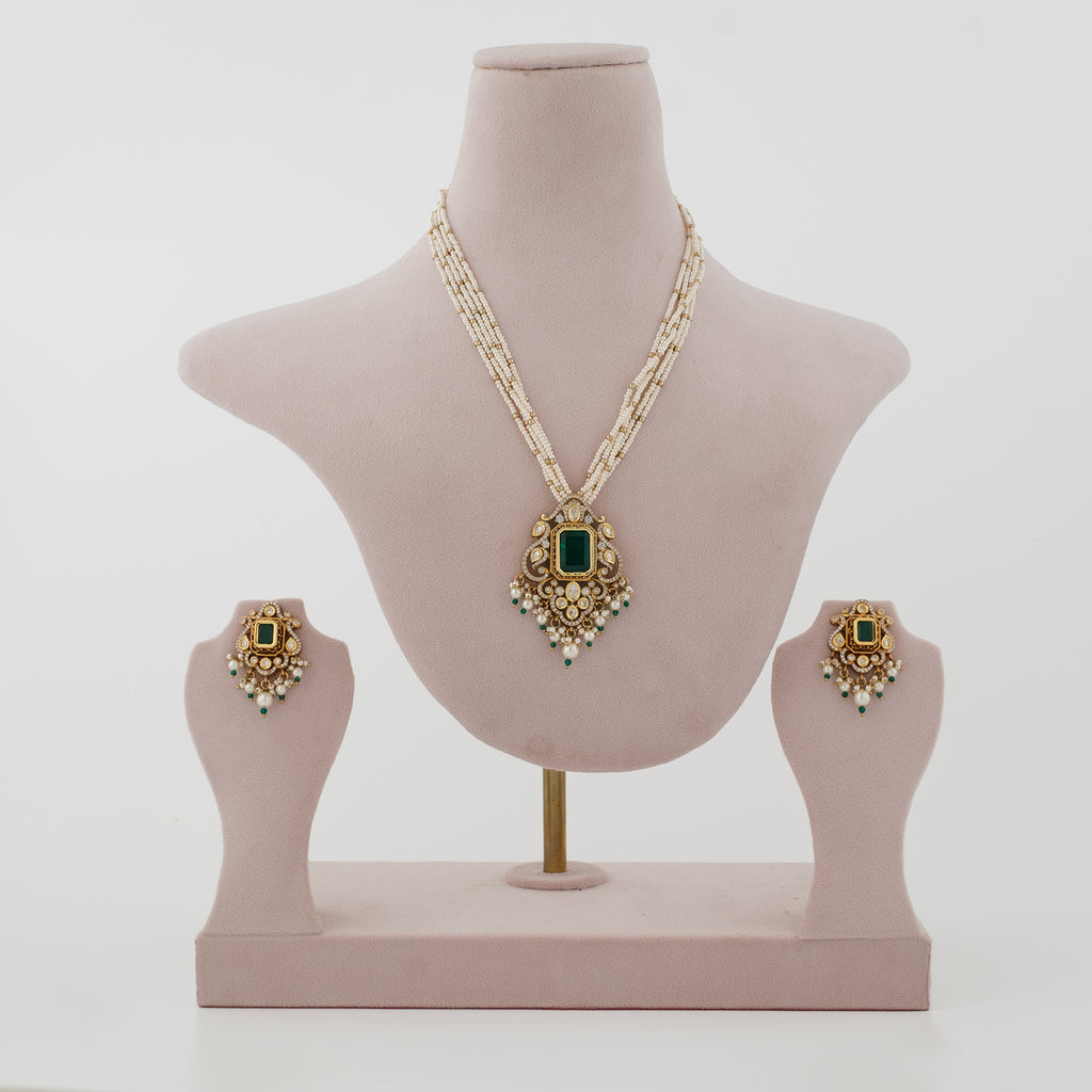Aarivya emerald-green artificial necklace set with ivory bead strands and matching earrings