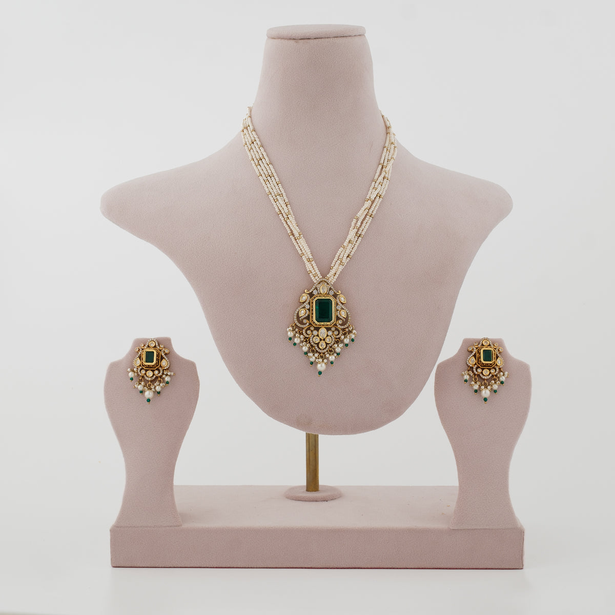 Aarivya emerald-green artificial necklace set with ivory bead strands and matching earrings