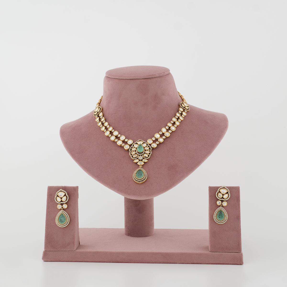 Aarshiya gold-tone artificial necklace set with mint teardrop stones and matching earrings