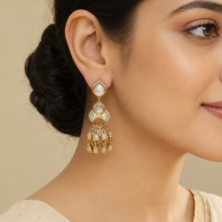 Indian model wearing Aavya gold polki-look floral cage jhumka earring in side profile