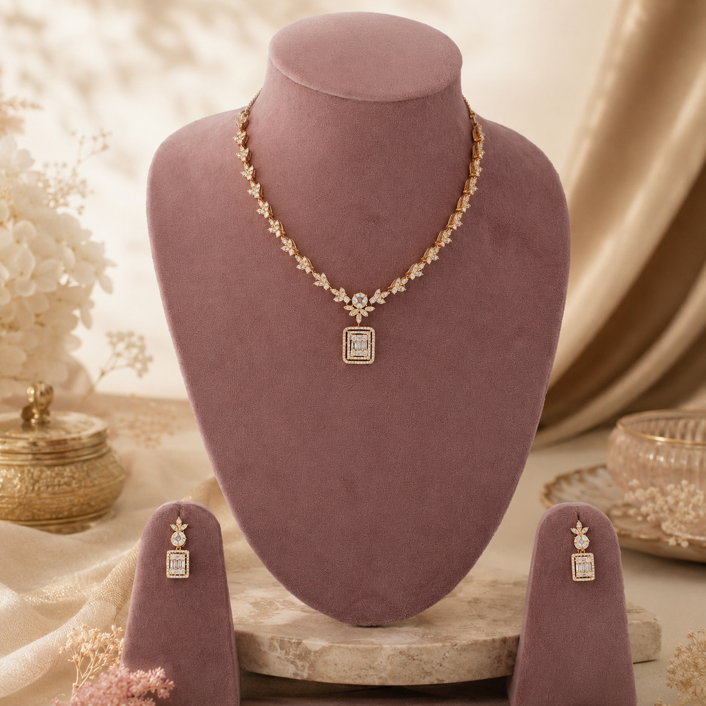 Aurelia gold-tone necklace with leaf-pattern stones and rectangular pendant