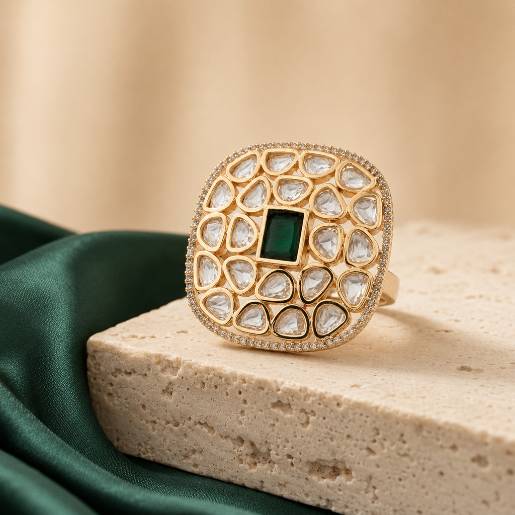 Cushion-shaped Kundan-look cocktail ring displayed with green fabric