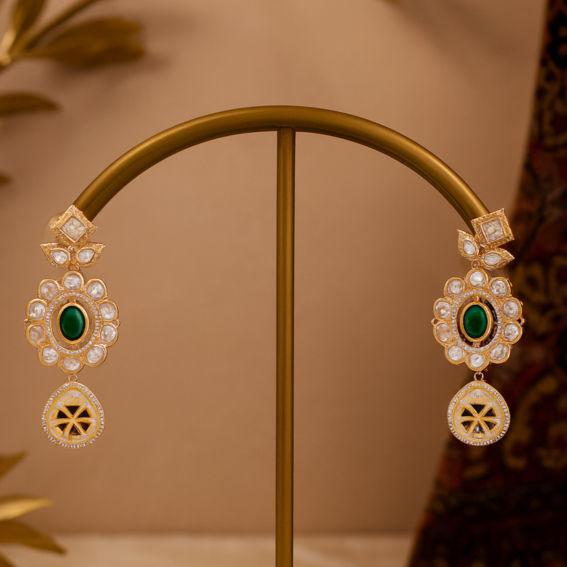 Ornate earrings on a gold stand with a warm background