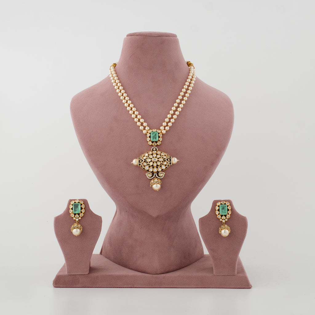 Haritprabha double-strand white moti Kundan necklace set with light-green stone and matching earrings