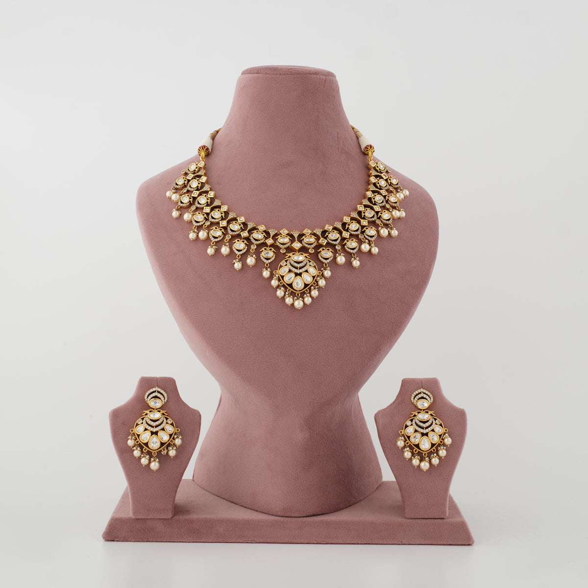 Hiranya gold-plated artificial Kundan necklace set with diamond-look stones and white moti