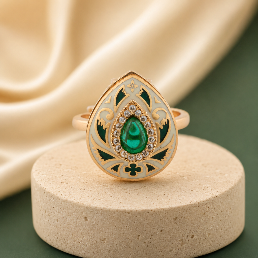 Gold-finish green Meenakari ring on an elegant neutral display