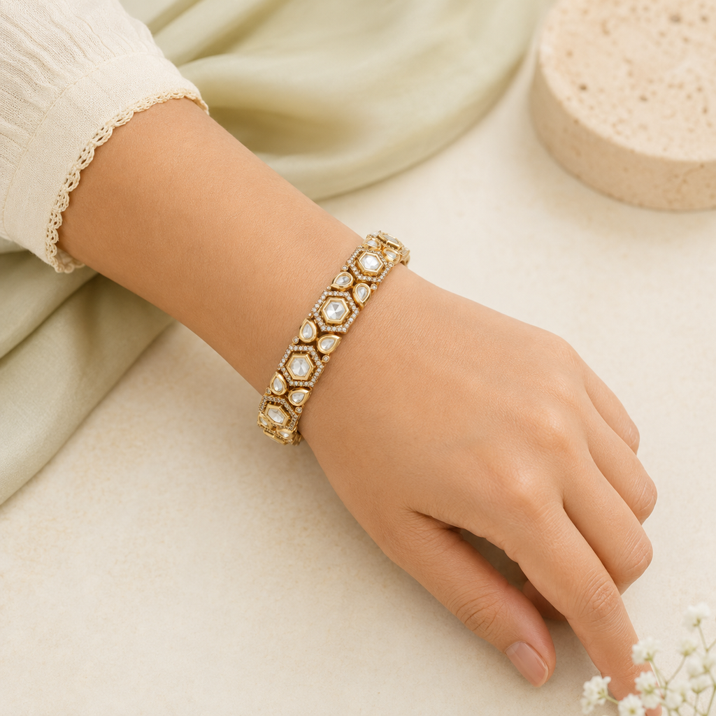 Woman wearing Ishani gold geometric Kundan-style kada bangle