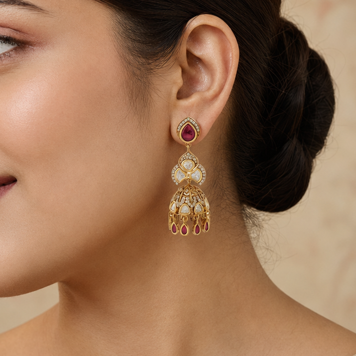 Indian model wearing Kashvi gold polki-look floral jhumka earring with ruby accents