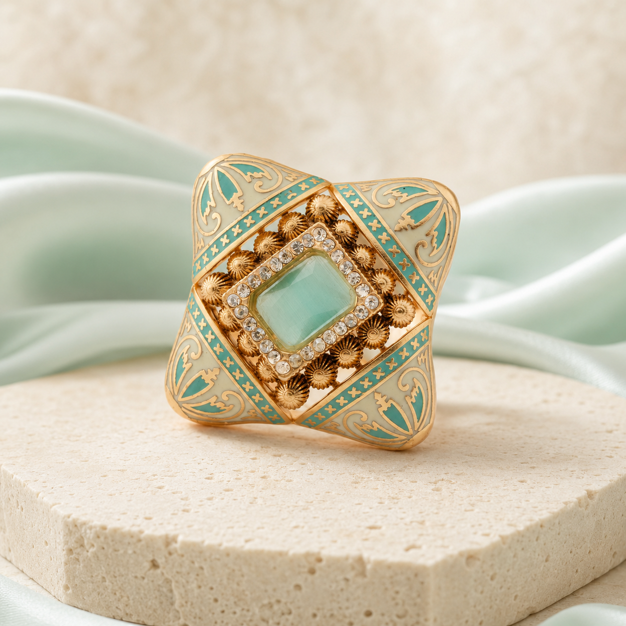 Mint Meenakari statement ring with clear accents on a luxury neutral background