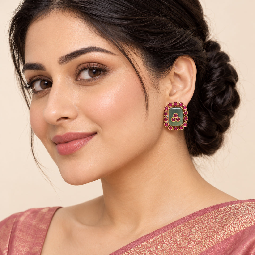 Indian model in a dusty rose saree wearing a Kavisha sage green and ruby-colour rectangular stud earring
