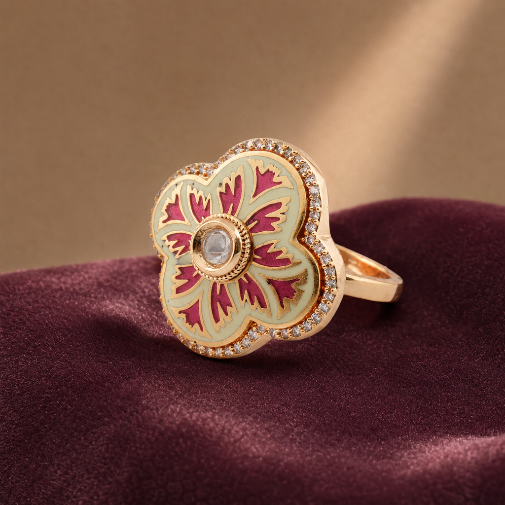 Pink and ivory floral statement ring displayed on burgundy fabric