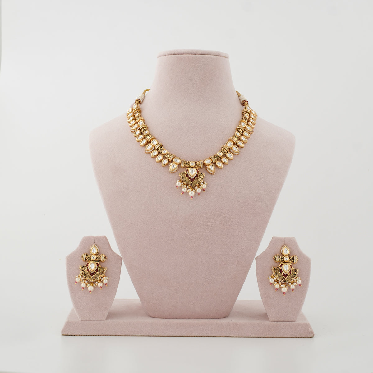 Rajvanya gold-tone artificial necklace set with clear diamond-look stones and matching earrings
