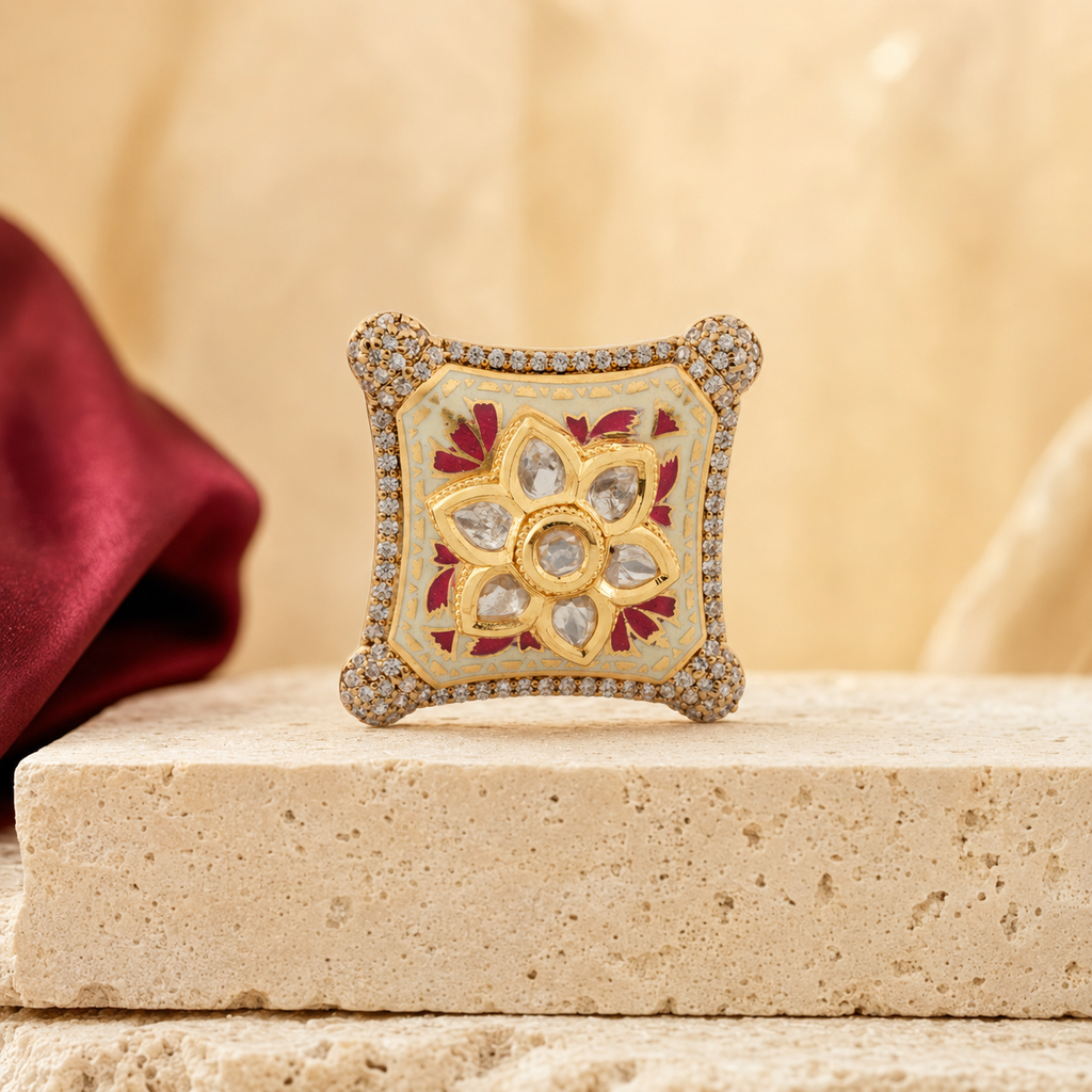 Riddhi gold-finish Meenakari statement ring on an elegant neutral display
