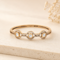 Ritvi gold Polki wave bracelet displayed in a warm ivory luxury setting