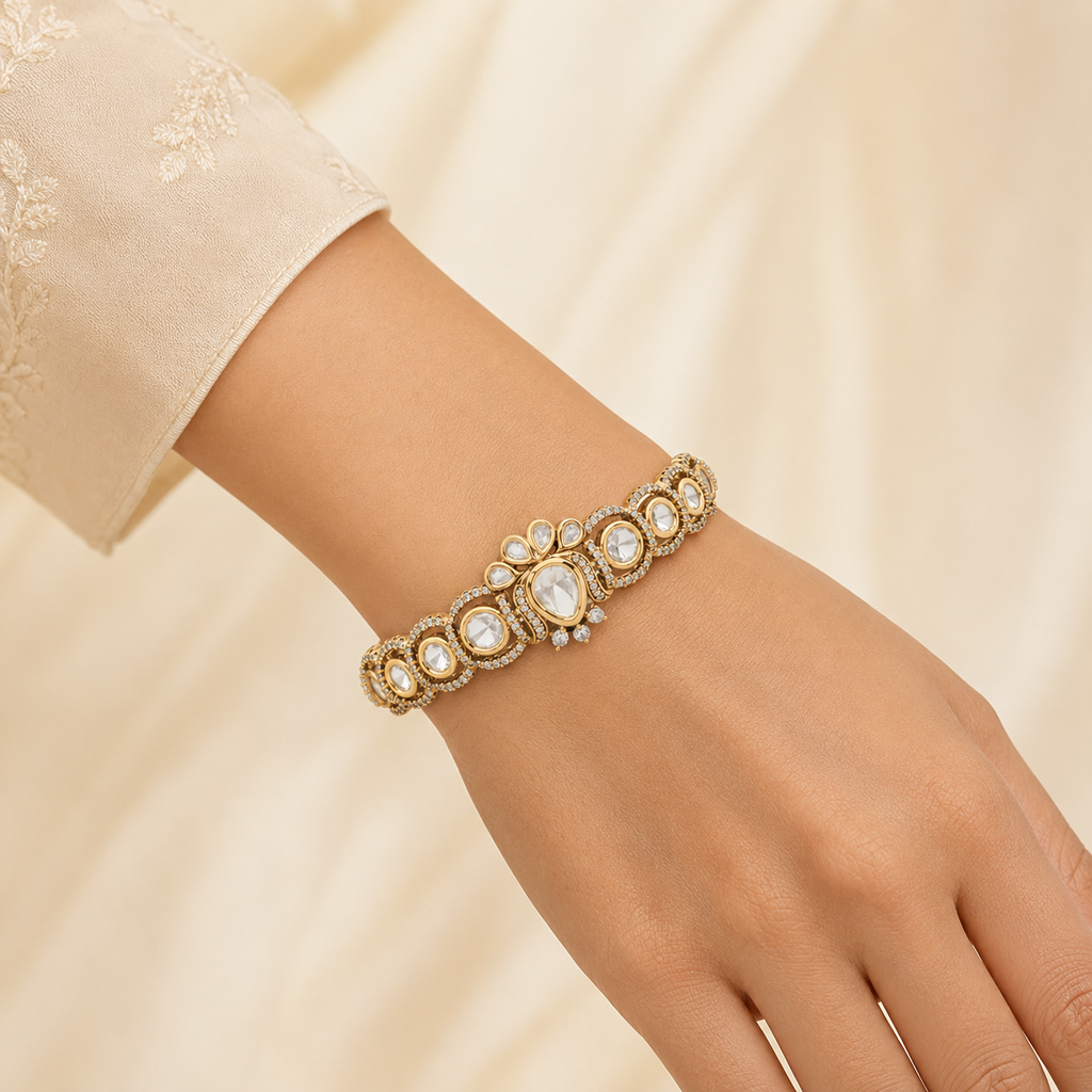 Woman wearing the Tarini gold Polki crest bracelet naturally on her wrist