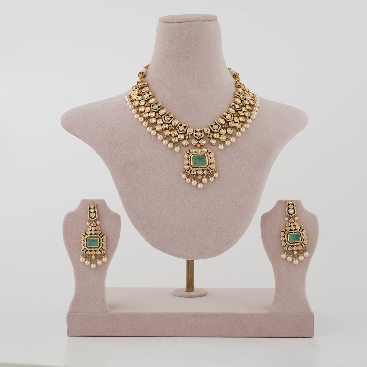 Zareeva gold-tone artificial necklace set with green centre stones and matching earrings