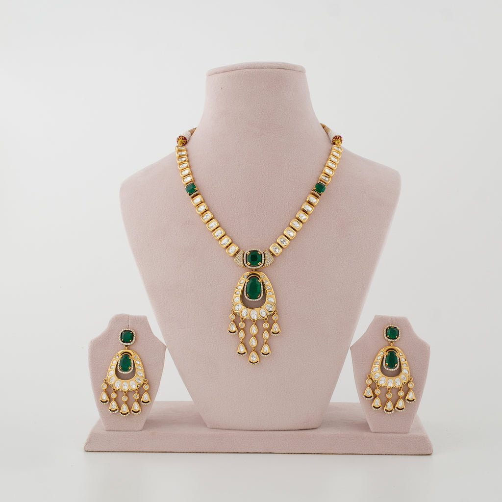 Zayra emerald Kundan necklace and chandelier earrings worn with an Indian ethnic outfit