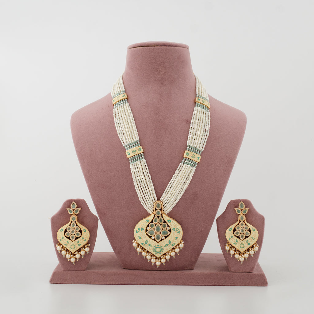 Zivanya mint artificial necklace set with ivory bead strands and matching earrings