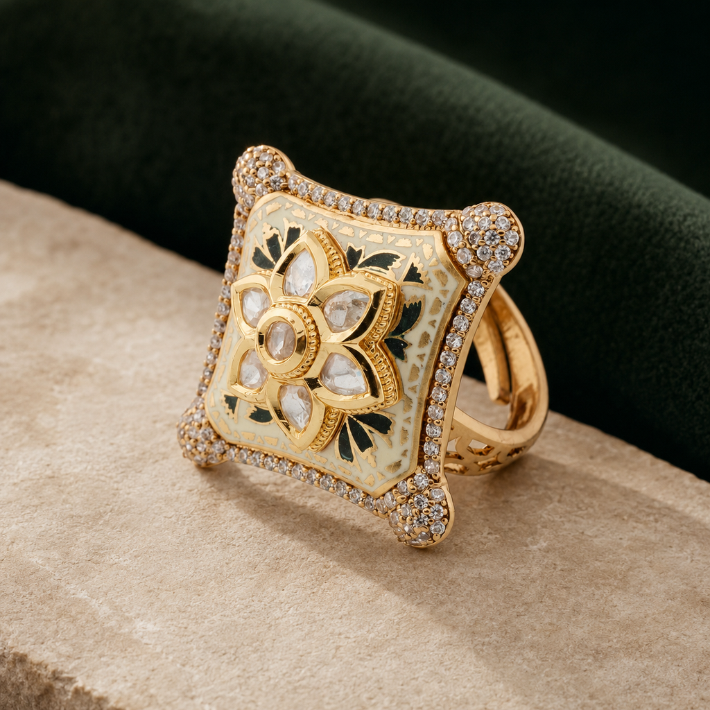 Ivory and green Meenakari statement ring displayed on a luxury neutral background